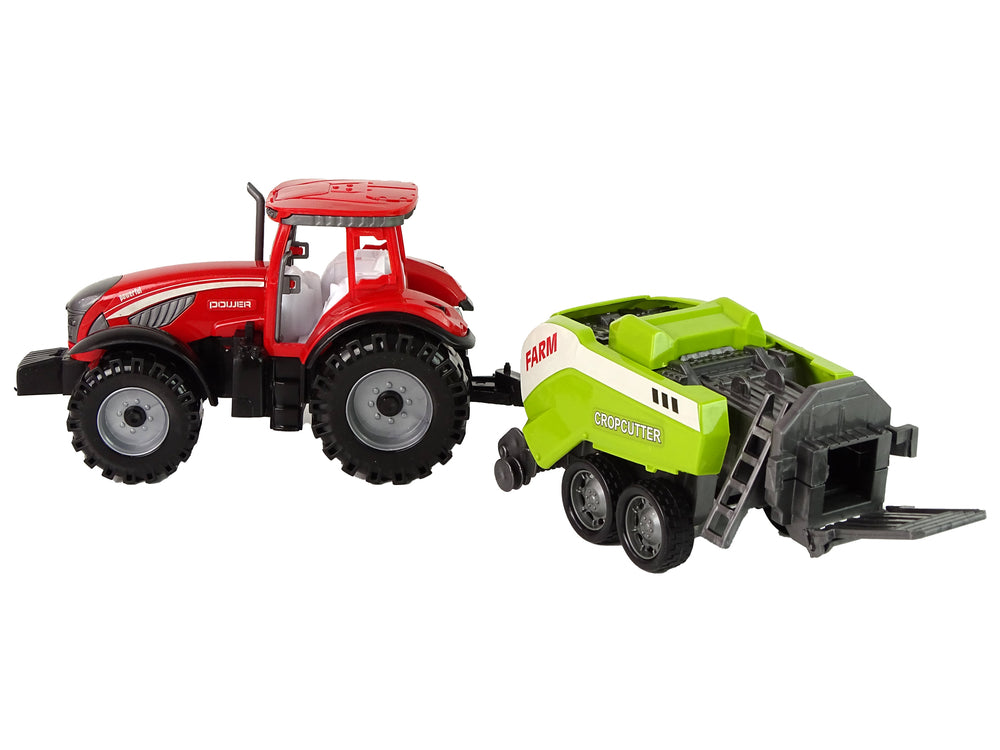 Roter Farmtraktor mit grüner Sämaschine Reibungsantrieb