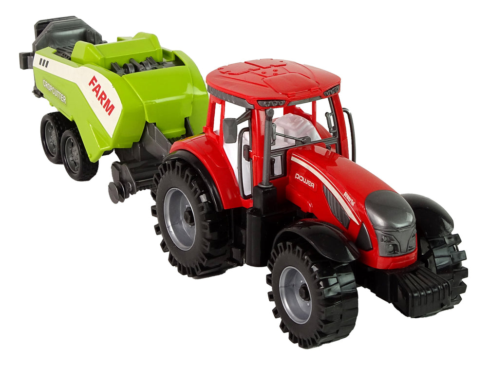 Roter Farmtraktor mit grüner Sämaschine Reibungsantrieb