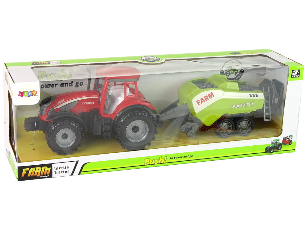 Roter Farmtraktor mit grüner Sämaschine Reibungsantrieb