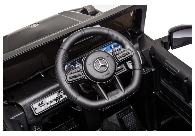 Elektro Kinderfahrzeug Mercedes G63 AMG Schwarz Lackiert Mit Ledersitz Und EVA-Reifen