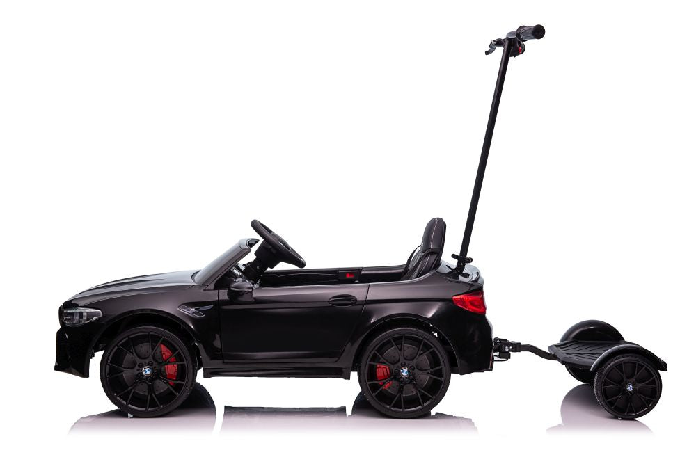 Battery-powered car BMW M5 with platform for parents, painted black