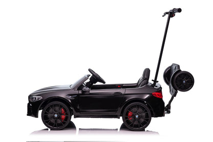 Battery-powered car BMW M5 with platform for parents, painted black